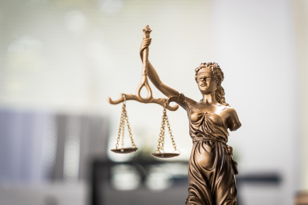 Close-up of Lady Justice statue symbolizing fairness and legal representation, often featured by Uber accident attorneys handling injury claims.

