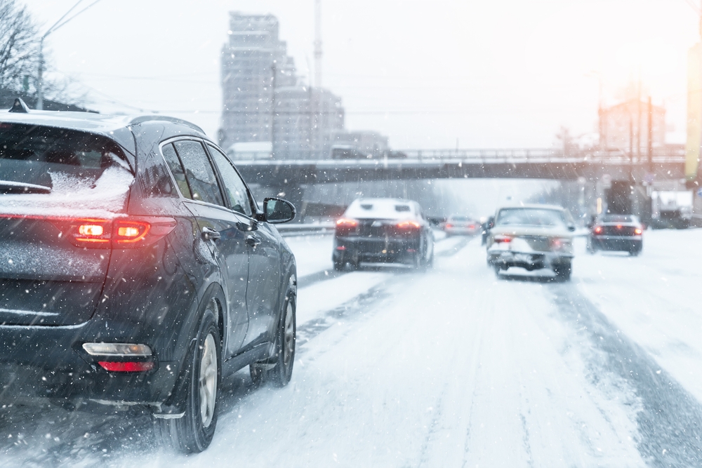 Cars driving on a snow covered highway during winter weather conditions in New Jersey